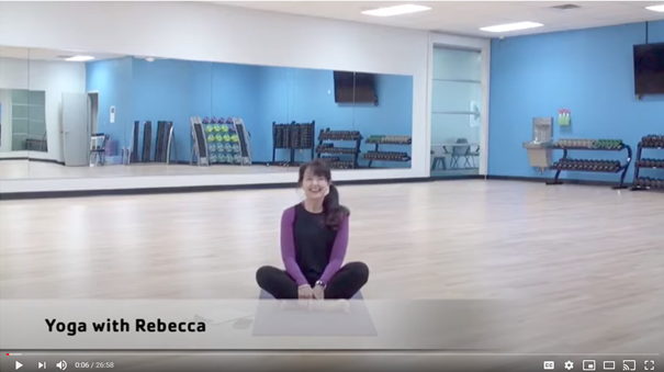 Seated YMCA yoga instructor