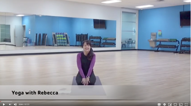 Seated YMCA yoga instructor